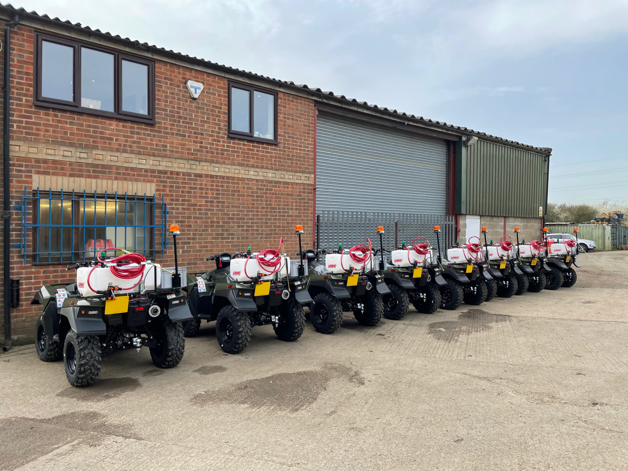 Suzuki ATVs lined up outside the Bedfordshire workshop