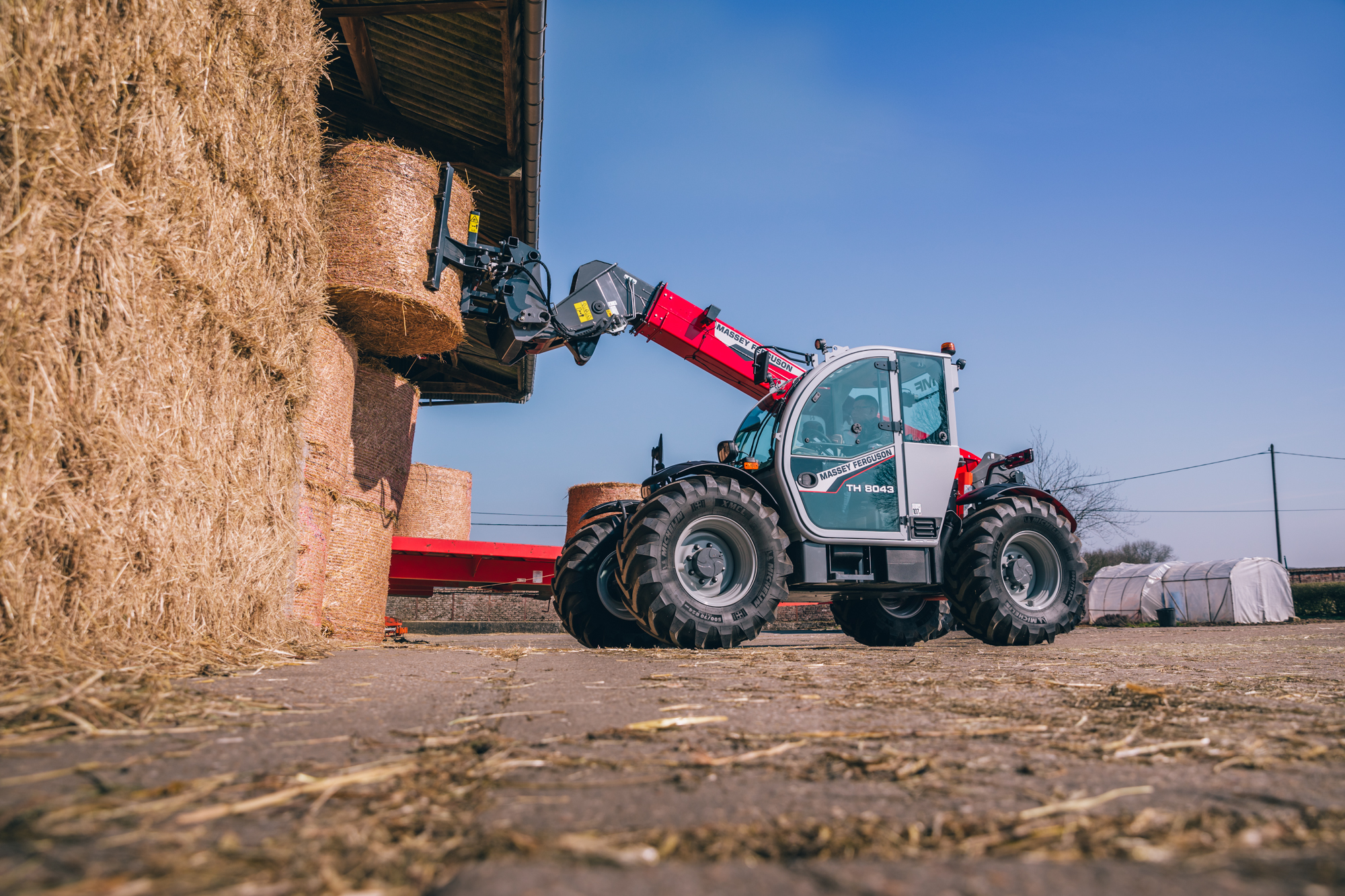 New Massey Ferguson MF TH telehandler - lifting bales