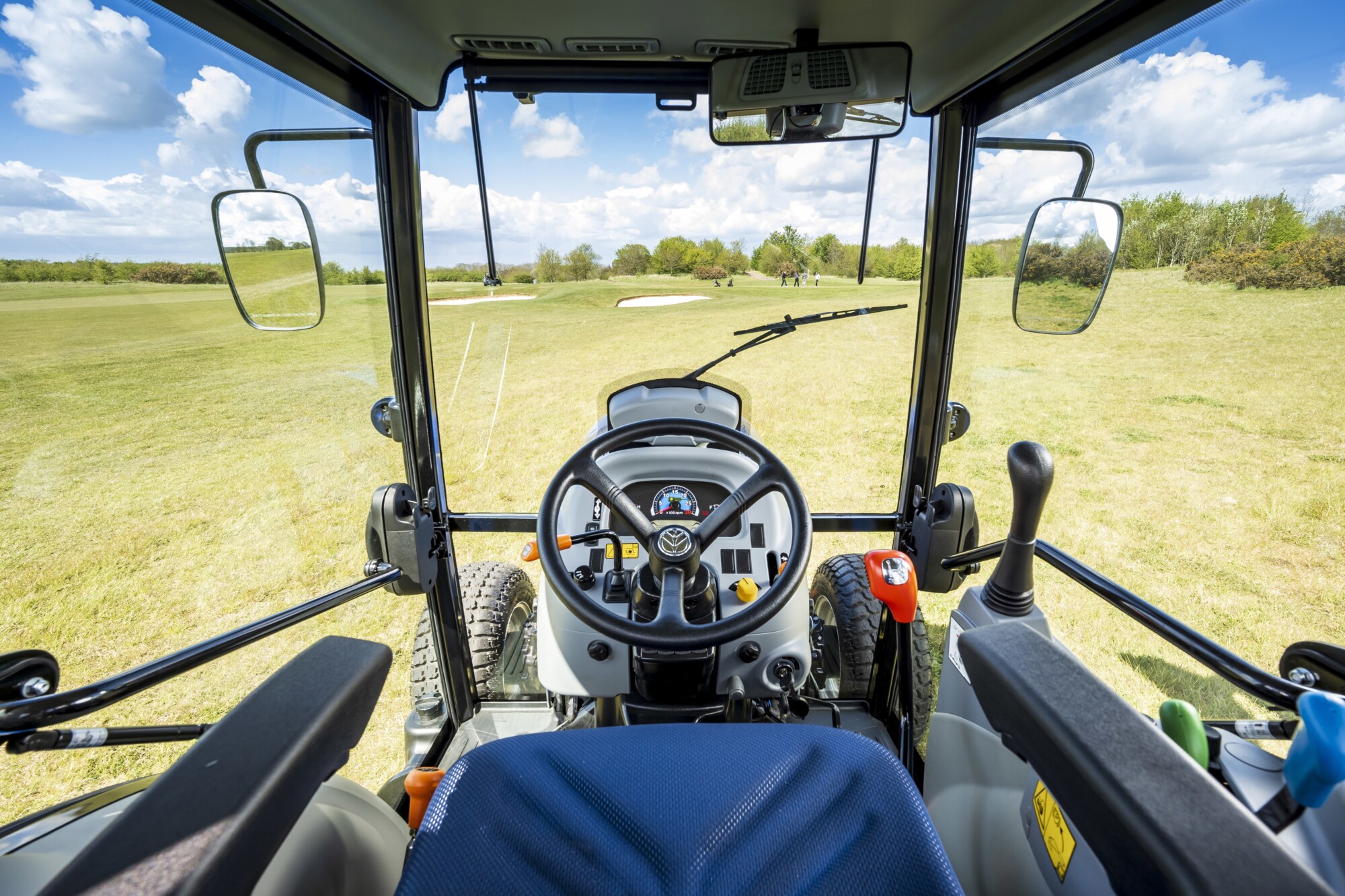 View from the cab of a tractor looking onto the field