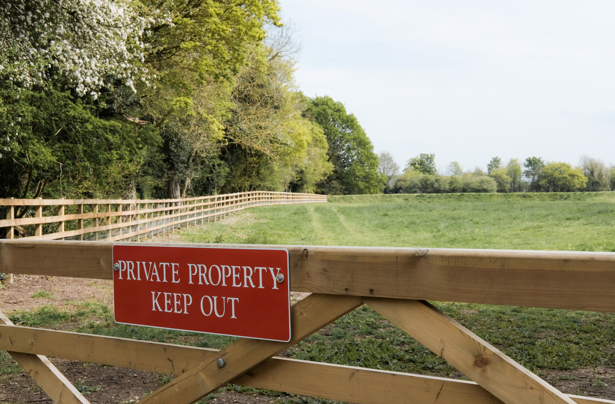 Newly installed Private Property sign erected onto a farm paddock gate in a rural location. Preventing rural crime