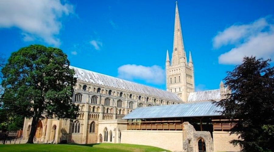 Norwich cathedral on blue sky sunny day used for harvest festival event
