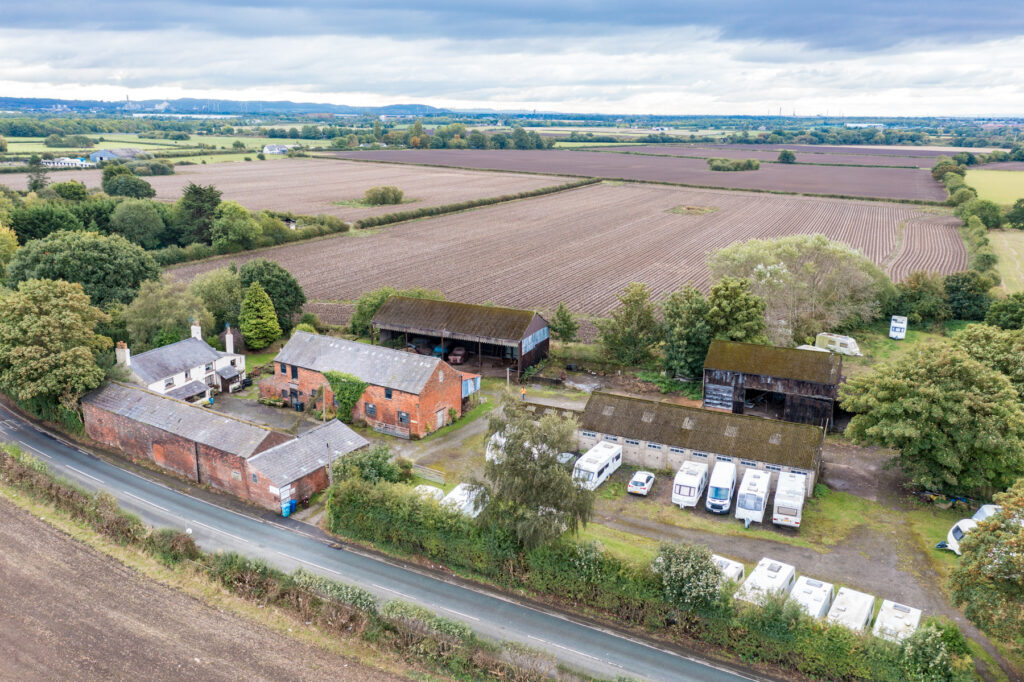 aerial shot of a farm and farm buildings 