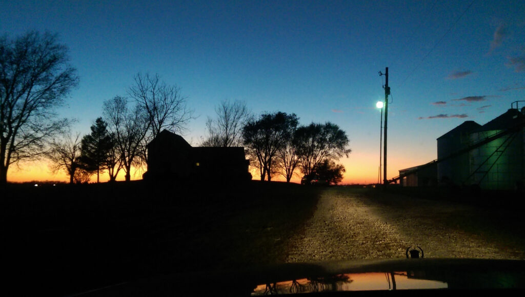 a farm at sunset