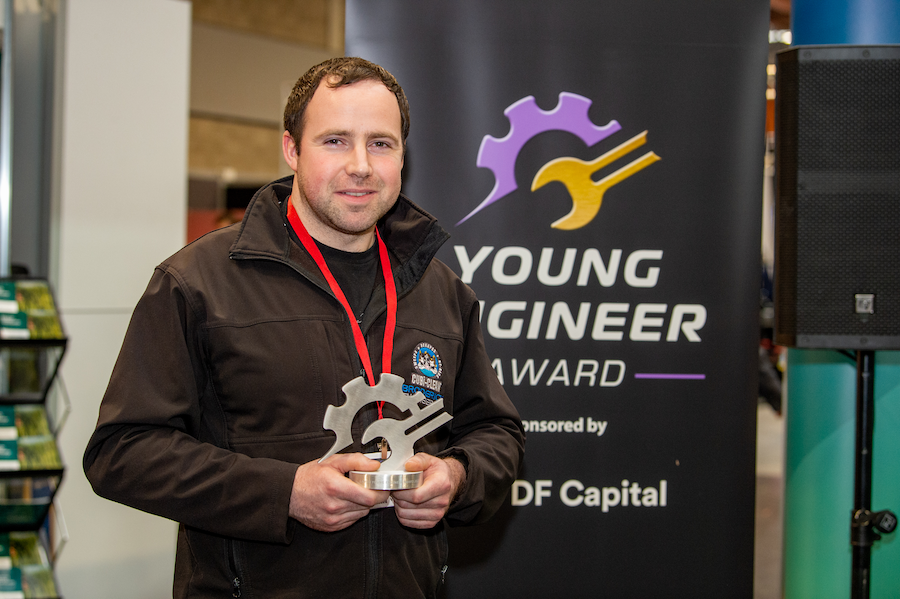 Photo of Daniel Broderick receiving the 2023 Young Engineer Award at LAMMA ‘23.