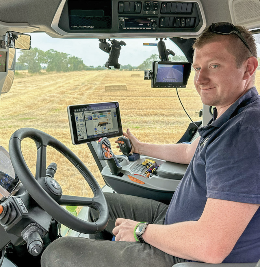 Photo of John Baker in the tractor cab.