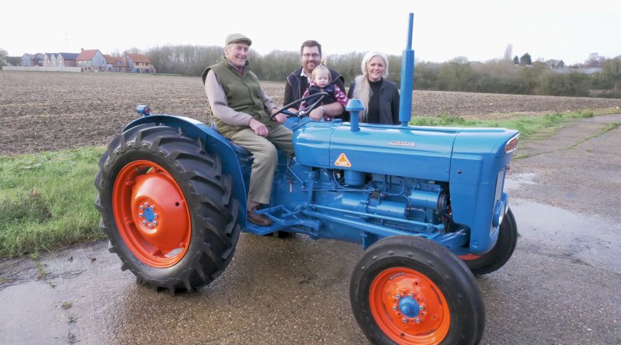 Fordson Super Dexta 1962 blue with red wheels, Ken Cook riding, with David and Jenna Filby and child