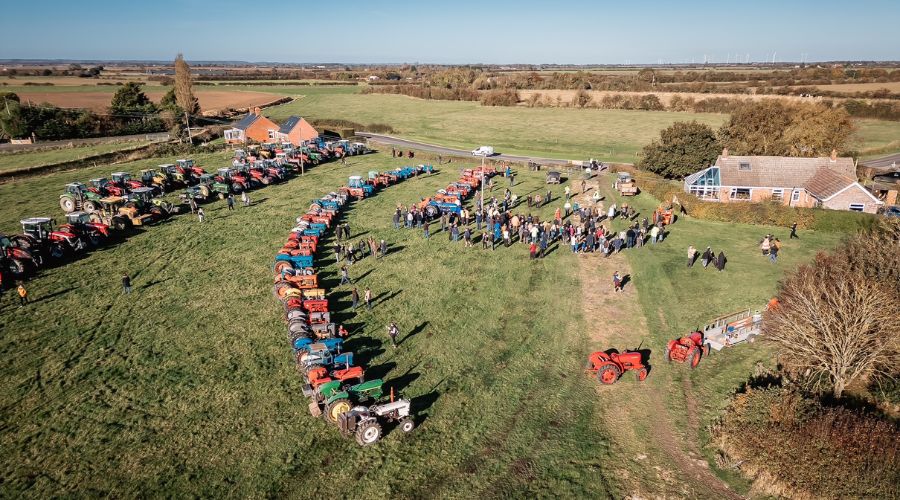 Drone shot of field of tractors