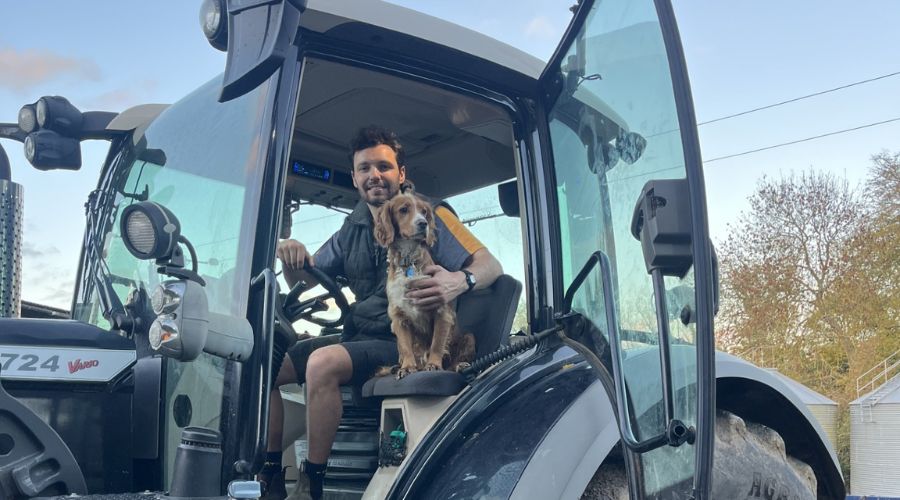 rob in a tractor with a dog
