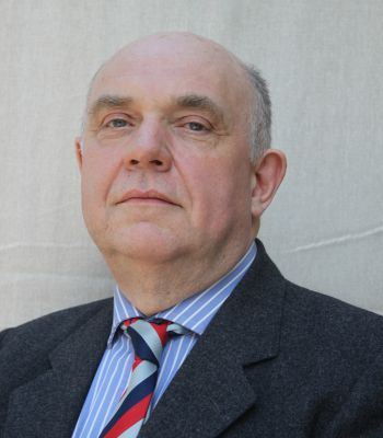 headshot of Bill Harrison, BASC director of firearms wearing a suit
