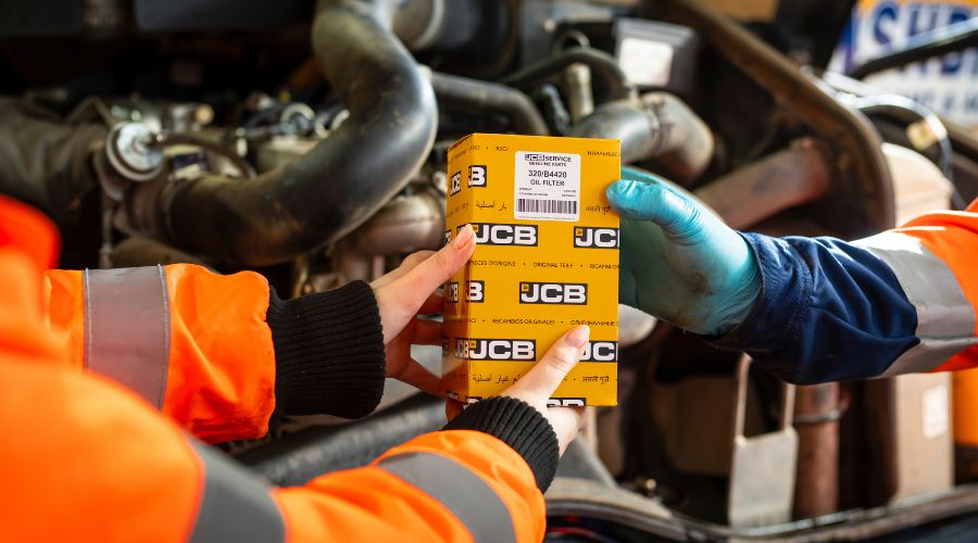 Boxed JCB part being handled