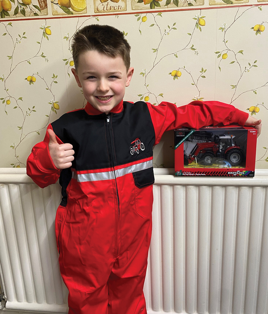 4.	Six-year-old Riley May from Ancaster, Grantham is pictured proudly holding his prize – a Massey Ferguson model donated by Peacock & Binnington.