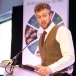 cammy wilson giving acceptance speech for NFUS award, standing at a lectern