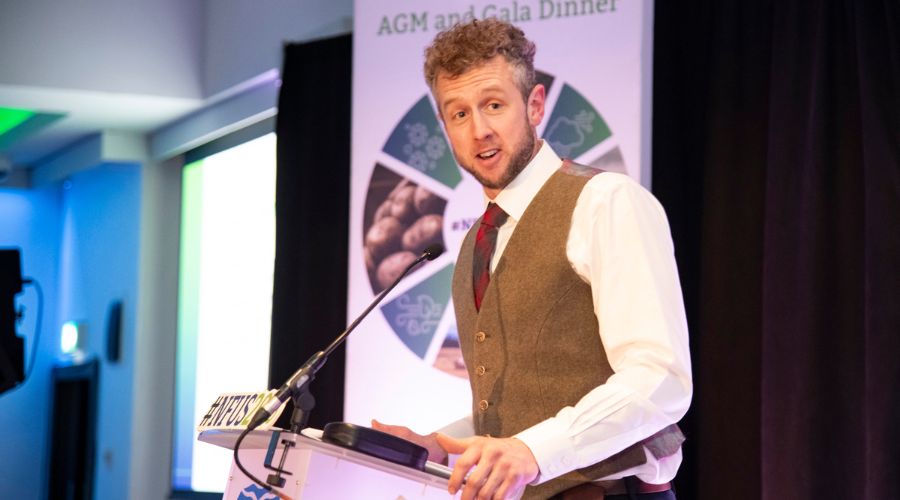cammy wilson giving acceptance speech for NFUS award, standing at a lectern