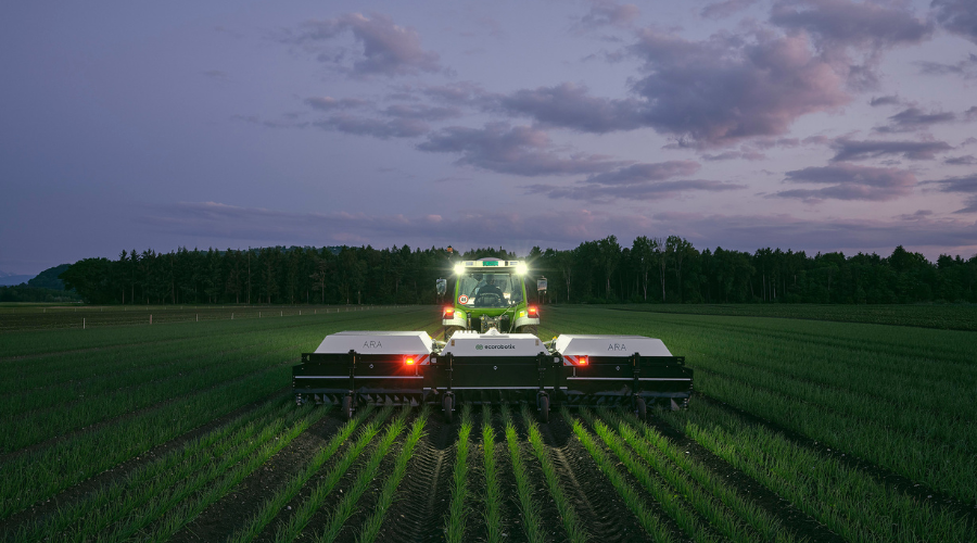 ARA spot sprayer in a field at night