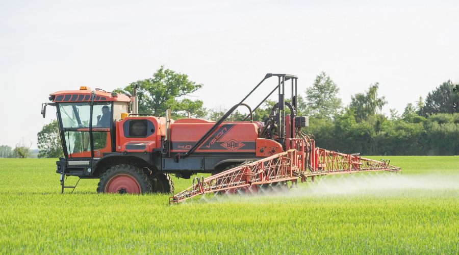 Self-propelled sprayer in a field